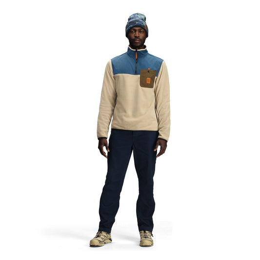 General front model shot of Topo Designs Vista 1/4 Zip Lightweight Fleece - Men's in "Oatmeal / Pond Blue"