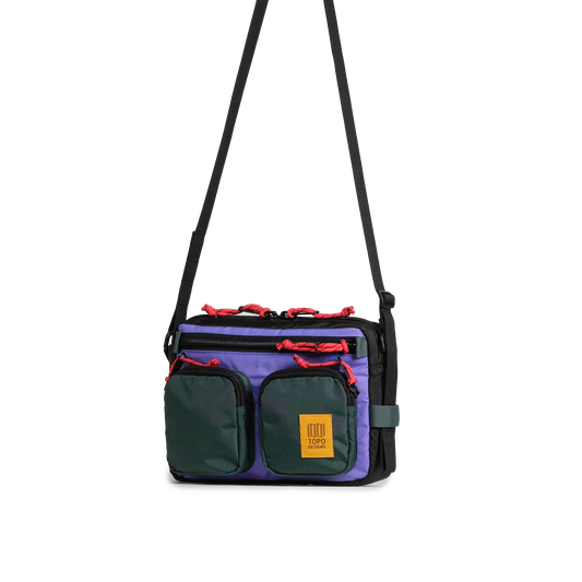 Front quarter view of Topo Designs Block Bag in "Very Peri / Forest"
